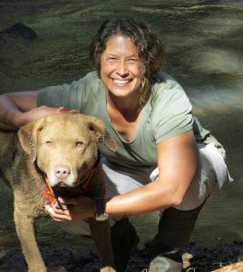 Karen DeMatteo with detection dog in the field